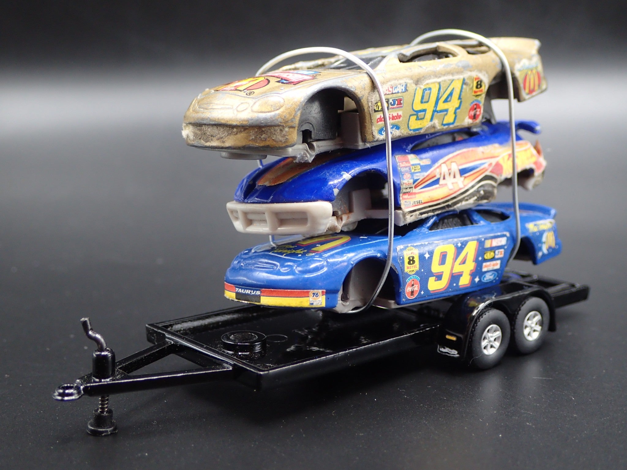 VINTAGE NASCAR 3 CARS CRUSHED ON A FLATBED TRAILER 1 64 SCALE DIECAST vintage-nascar-3-cars-crushed-on-a-flatbed-trailer-1-64-scale-diecast