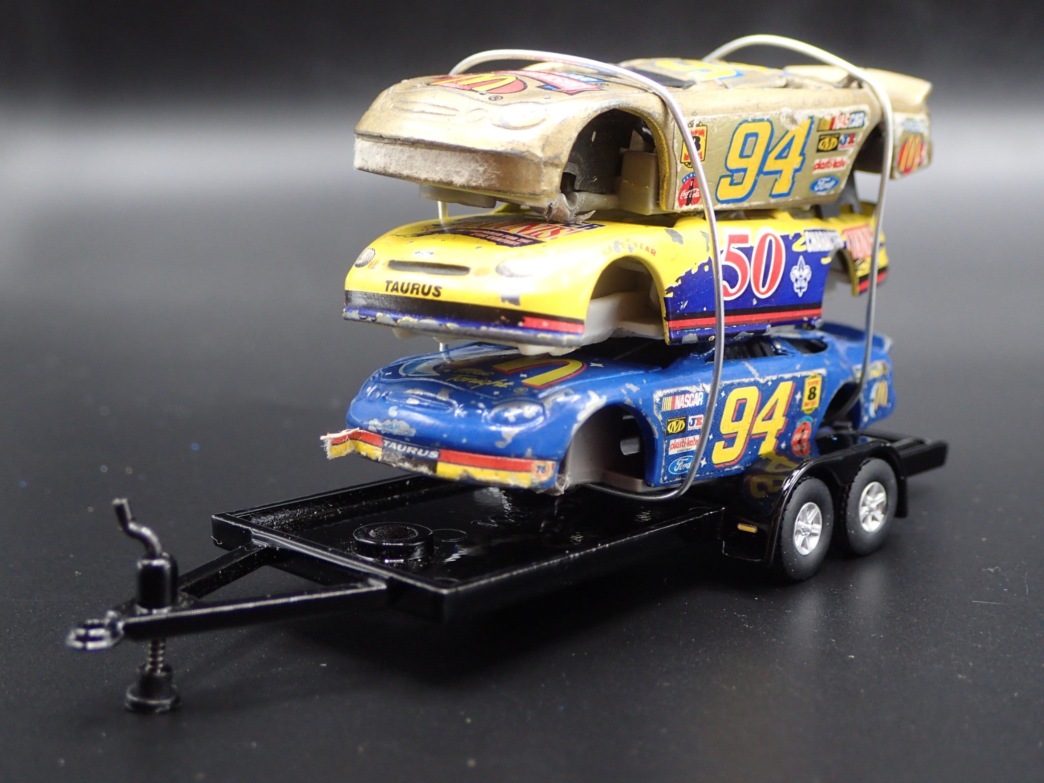 VINTAGE NASCAR 3 CARS CRUSHED ON A FLATBED TRAILER 1 64 SCALE DIECAST vintage-nascar-3-cars-crushed-on-a-flatbed-trailer-1-64-scale-diecast