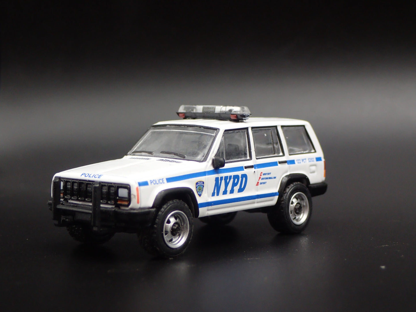 JEEP CHEROKEE XJ SPORT 4 DOOR NEW YORK NYPD POLICE 1:64 SCALE DIECAST MODEL CAR