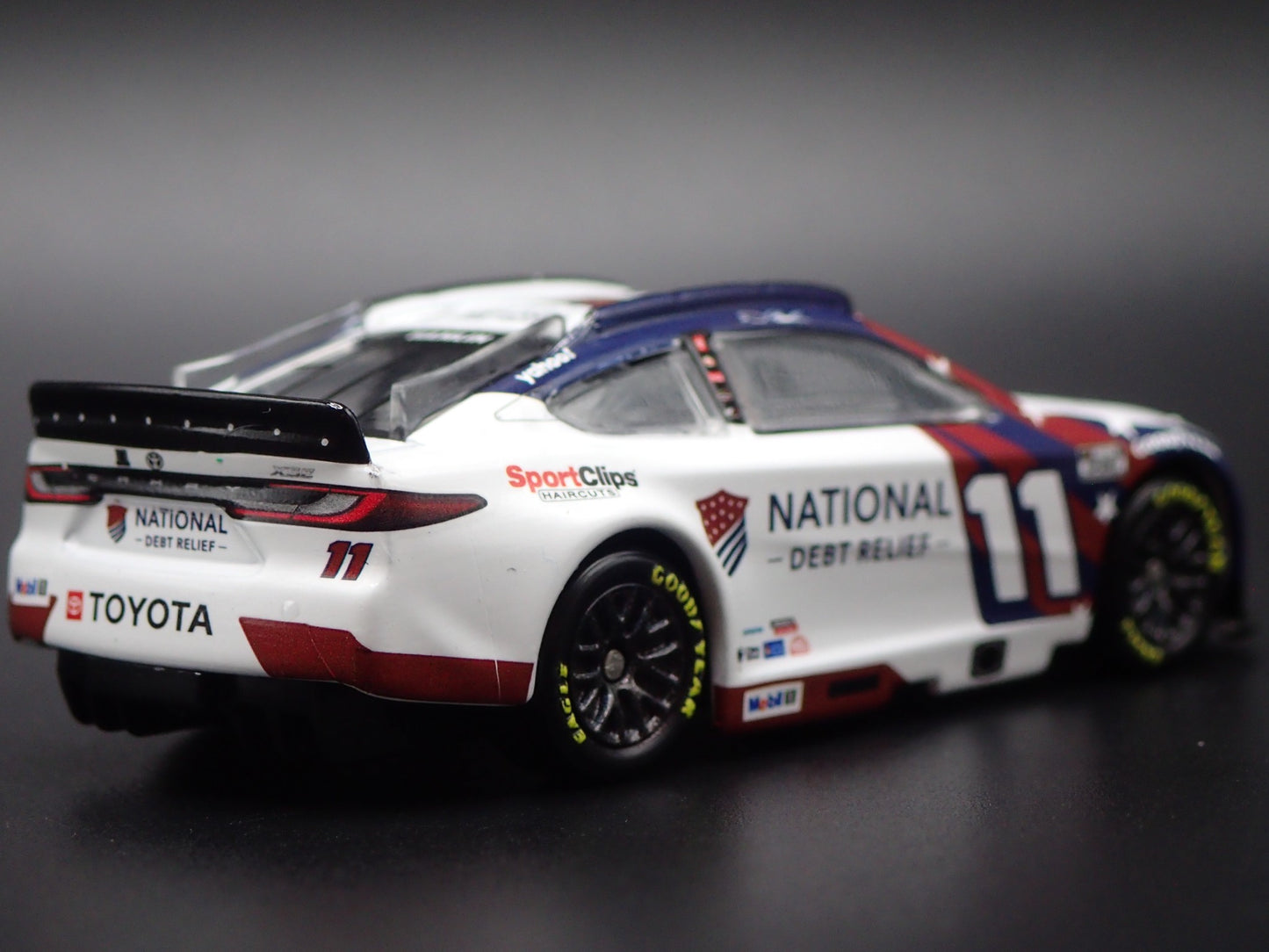 2025 25 TOYOTA CAMRY 11 DENNY HAMLIN DEBT RELIEF NASCAR 1:64 SCALE DIECAST CAR