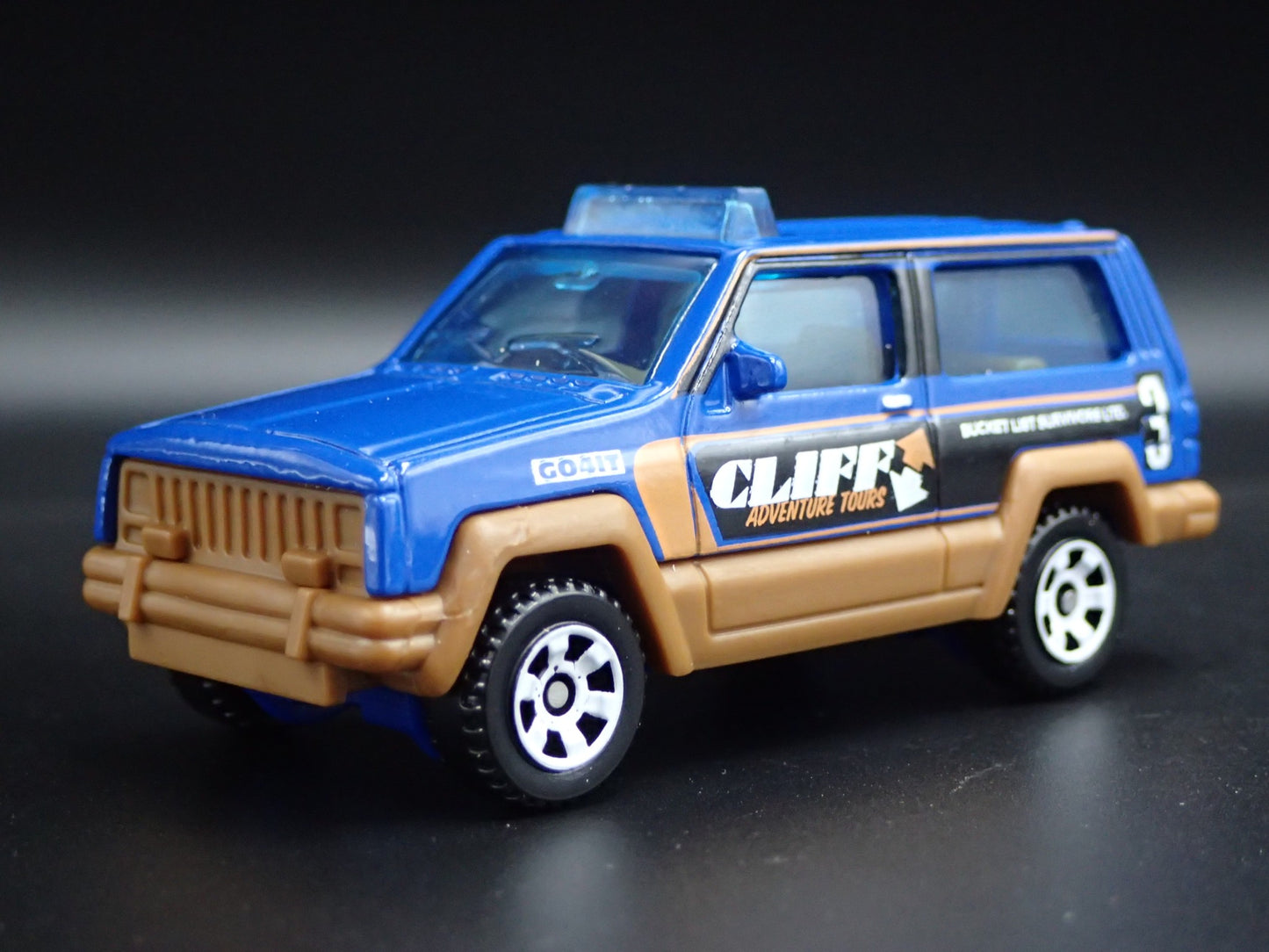 1984- 2001 JEEP CHEROKEE ADVENTURE TOURS W/ HITCH 1:64 SCALE DIECAST MODEL CAR