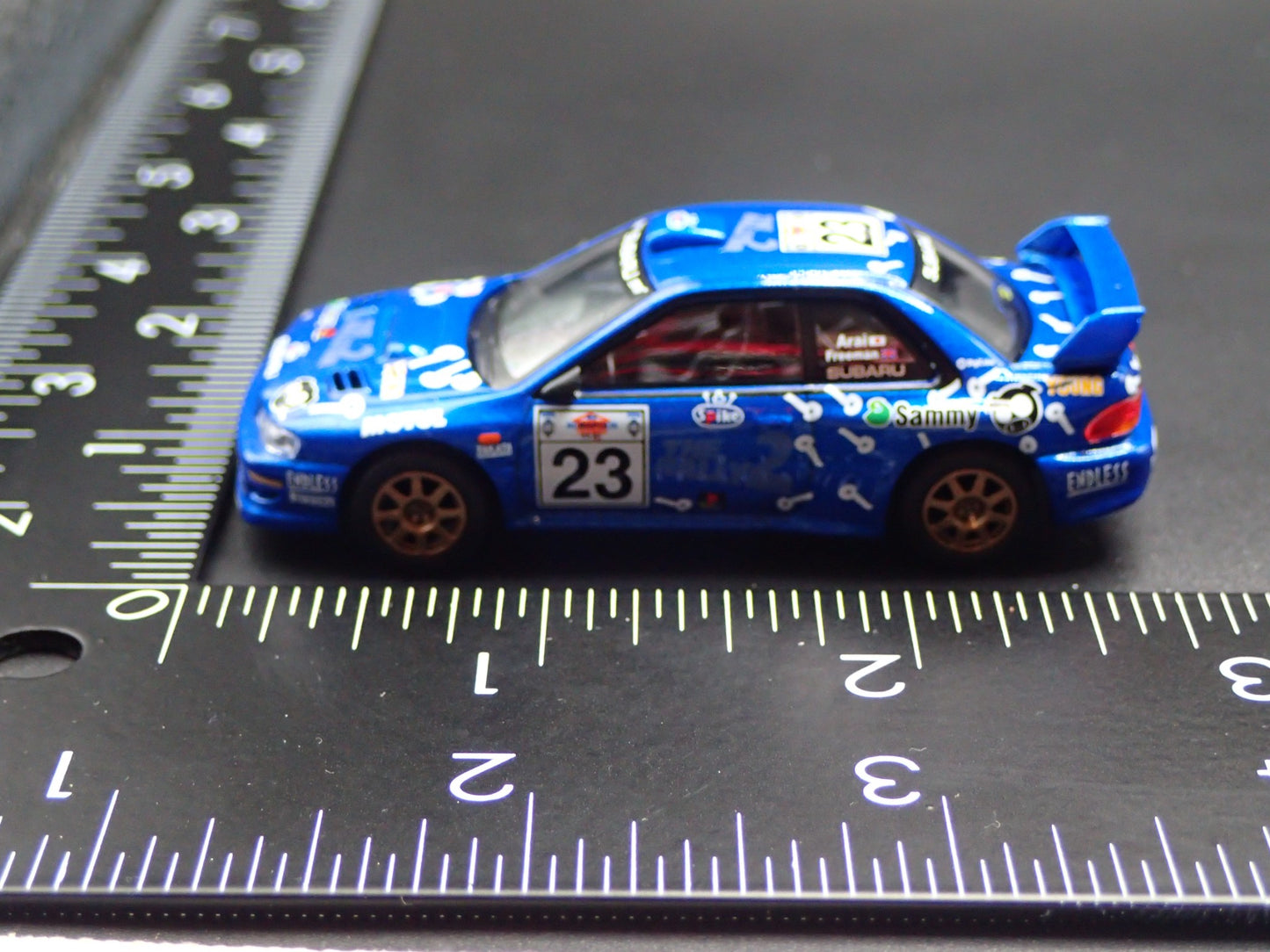 SUBARU IMPREZA WRC99 #23 RALLY 1:64 SCALE COLLECTIBLE DIORAMA DIECAST MODEL CAR