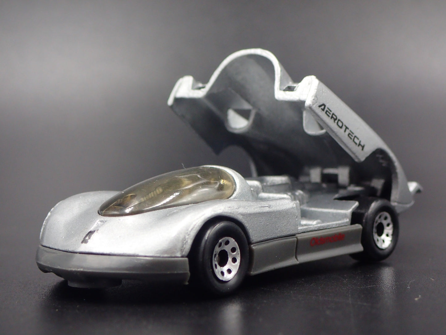 1987-1992 OLDS OLDSMOBILE AEROTECH SILVER 1:64 SCALE DIORAMA DIECAST MODEL CAR