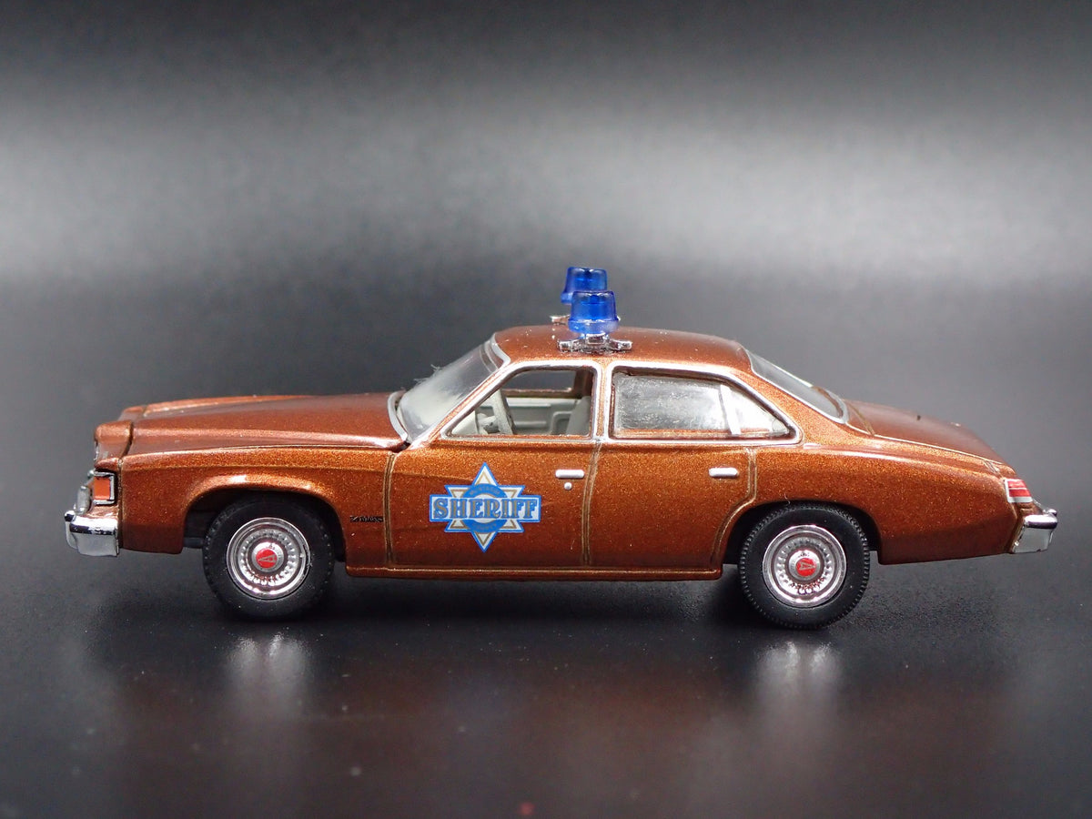 1977 PONTIAC LEMANS SHERIFF BUFORD T JUSTICE SMOKEY & THE BANDIT 1/64 MODEL CAR