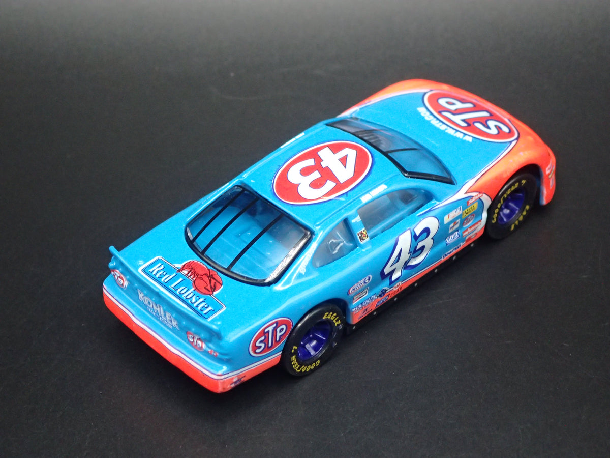 1999 99 PONTIAC GRAND PRIX 43 JOHN ANDRETTI STP NASCAR 1:64 DIECAST CAR