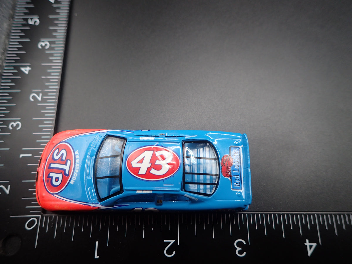 1999 99 PONTIAC GRAND PRIX 43 JOHN ANDRETTI STP NASCAR 1:64 DIECAST CAR