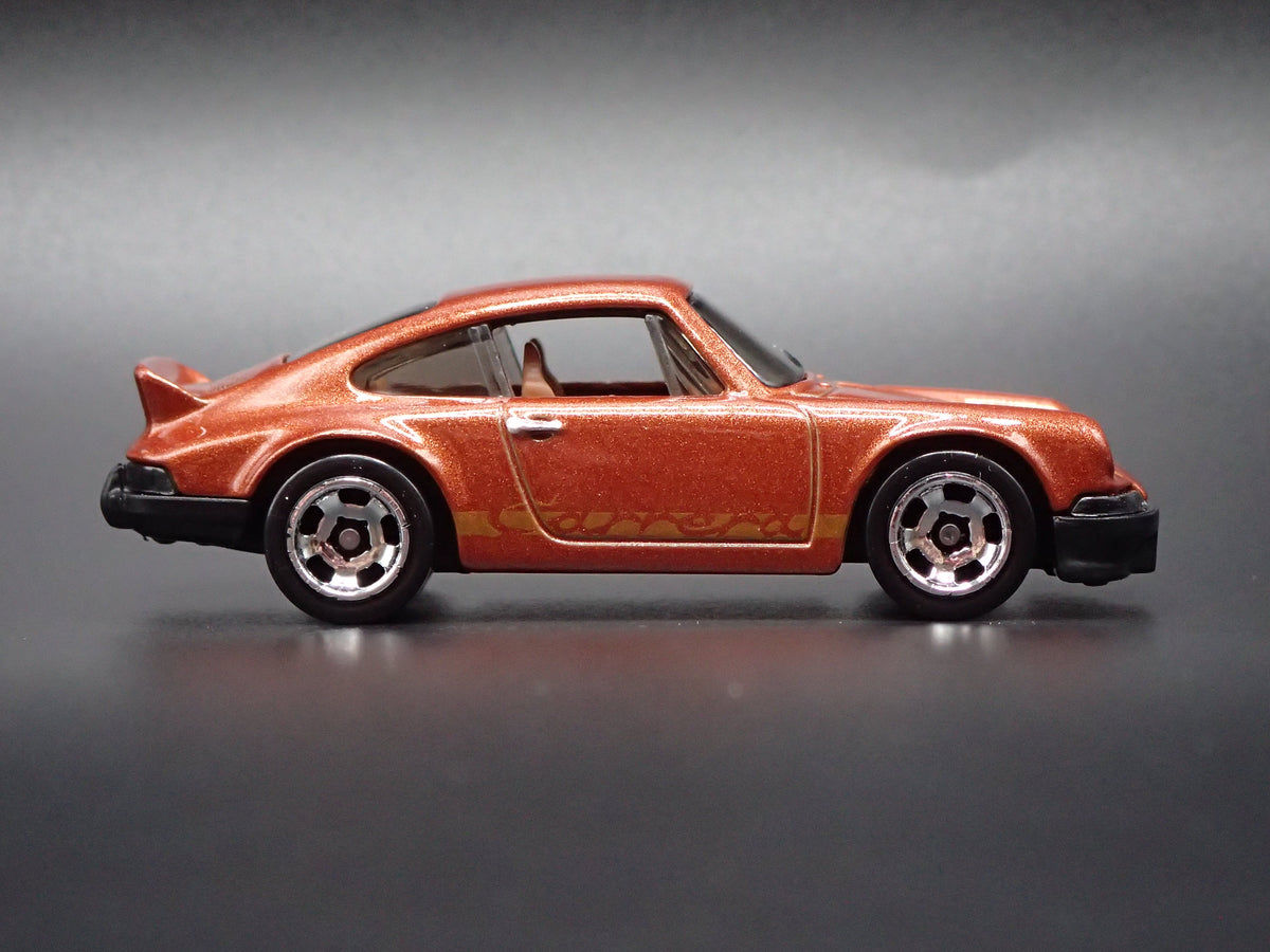 1973-1977 PORSCHE 911 CARRERA RS 2.7 1:64 SCALE COLLECTIBLE DIECAST MODEL CAR