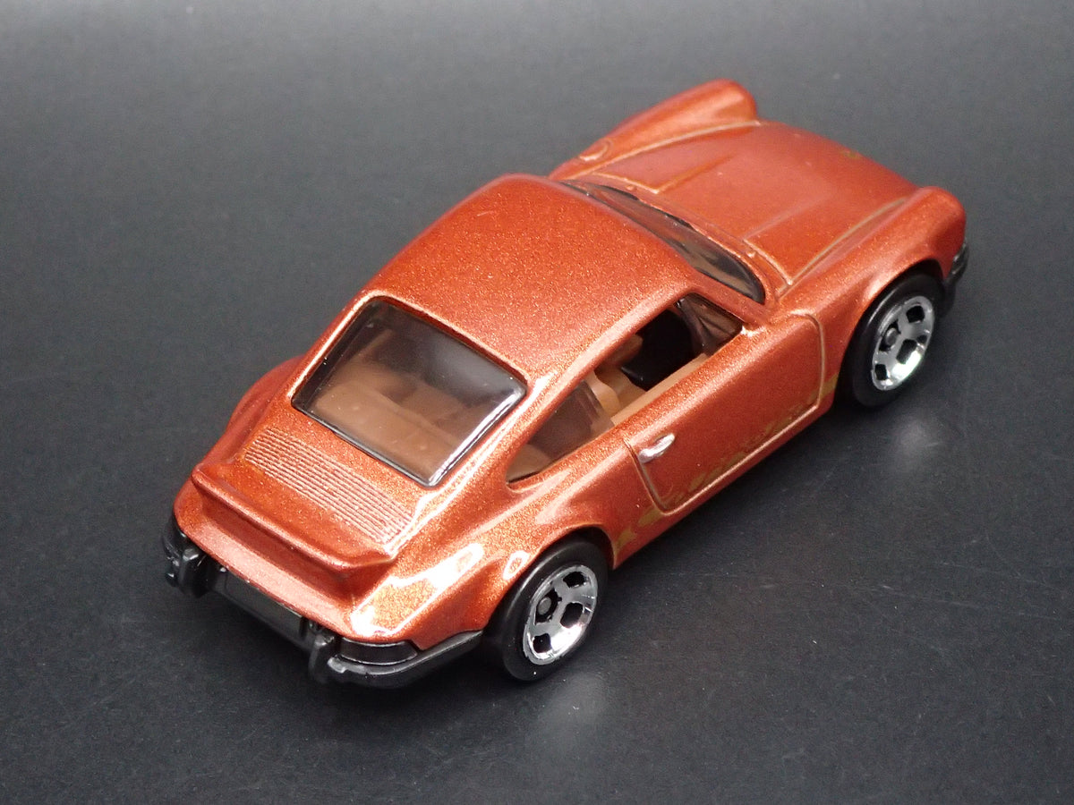 1973-1977 PORSCHE 911 CARRERA RS 2.7 1:64 SCALE COLLECTIBLE DIECAST MODEL CAR