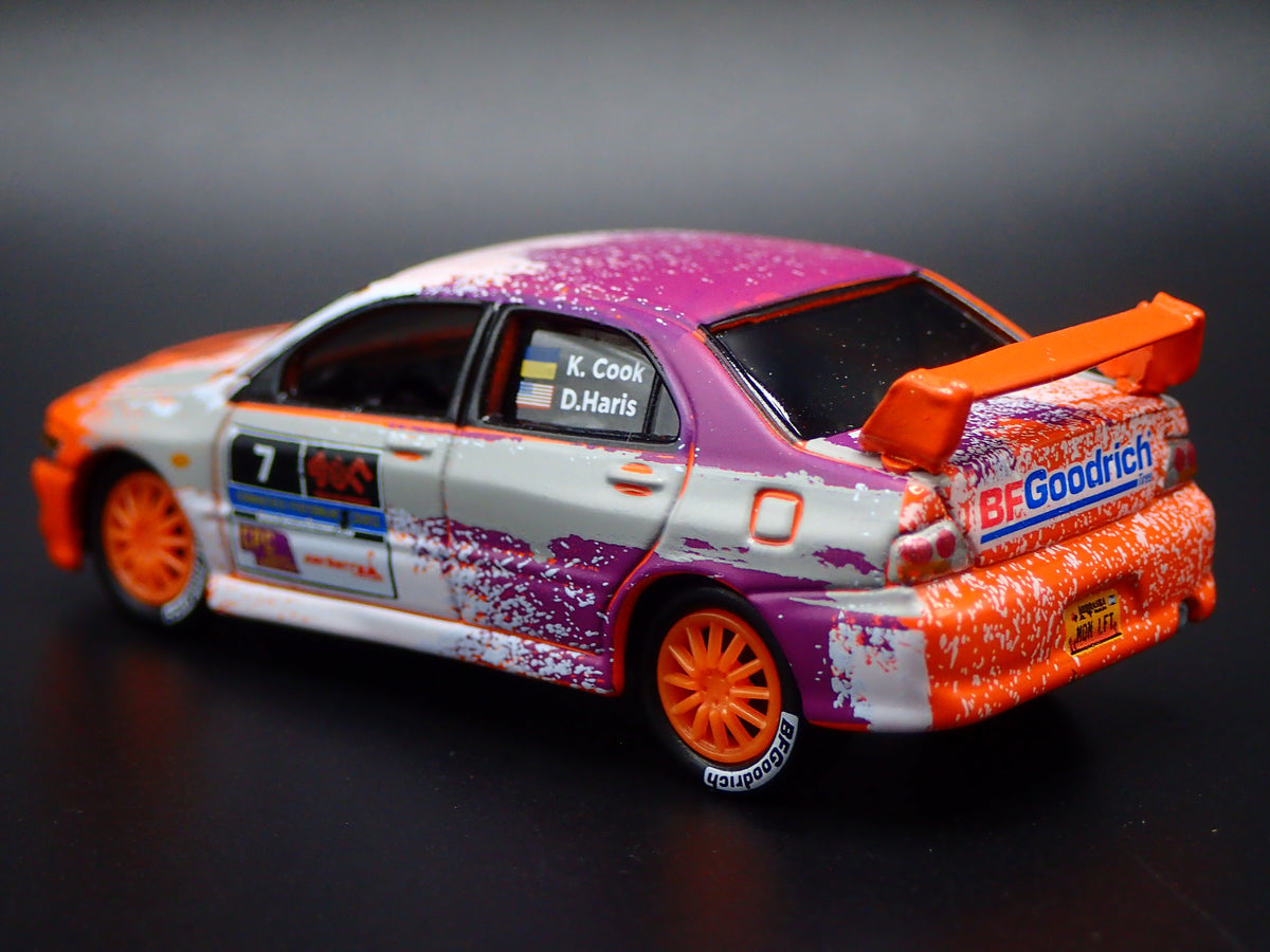 2003-2005 MITSUBISHI LANCER EVOLUTION VIII RALLY ORANGE 1:64 SCALE DIECAST MODEL CAR