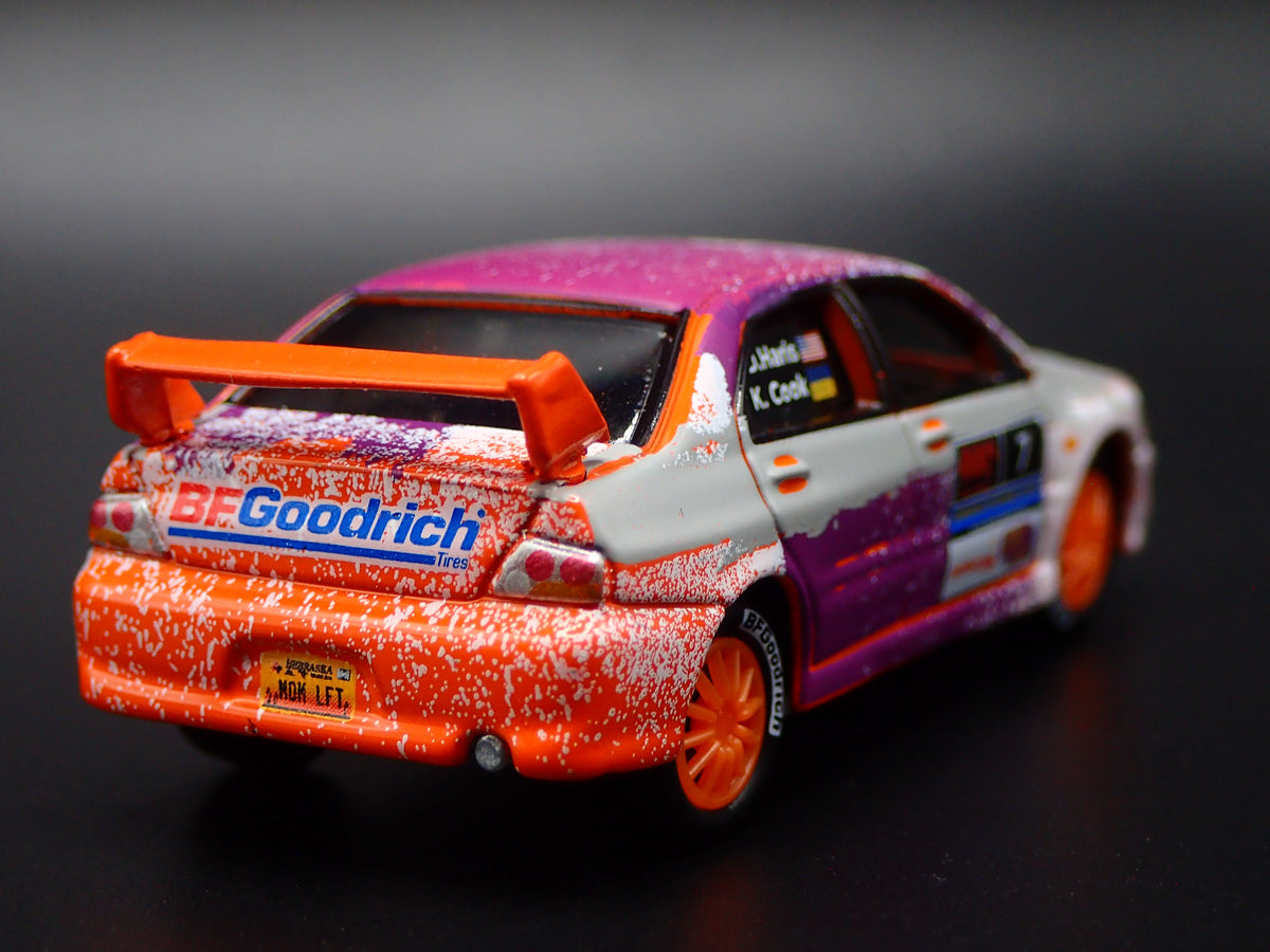 2003-2005 MITSUBISHI LANCER EVOLUTION VIII RALLY ORANGE 1:64 SCALE DIECAST MODEL CAR