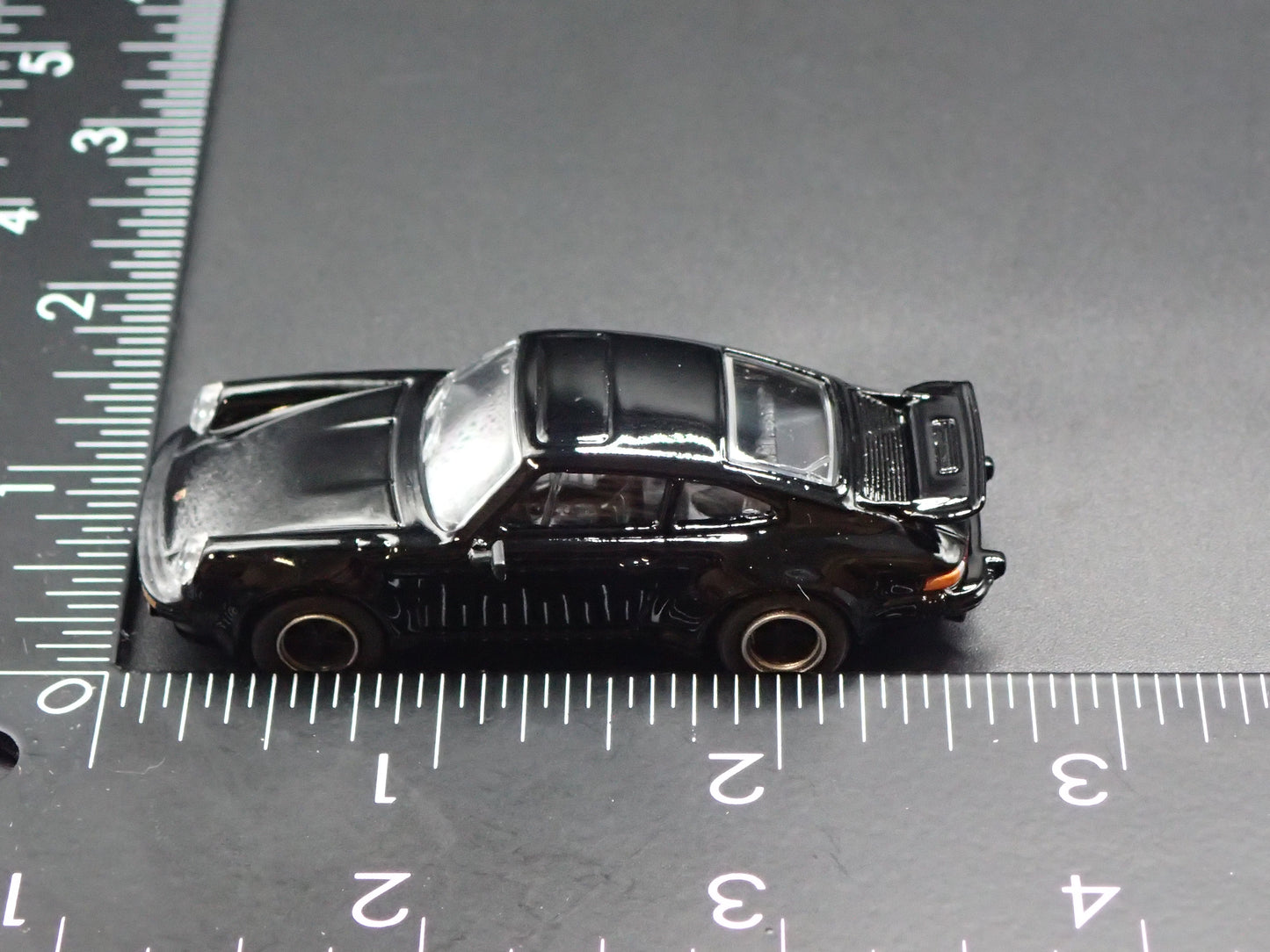 1975 - 1989 PORSCHE 930 TURBO BLACK 1:64 SCALE COLLECTIBLE DIORAMA DIECAST MODEL CAR