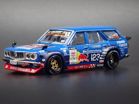 1971-1978 MAZDA RX3 STATION AGON RED BULL MAD MIKE 1:64 SCALE DIORAMA DIECAST MODEL CAR