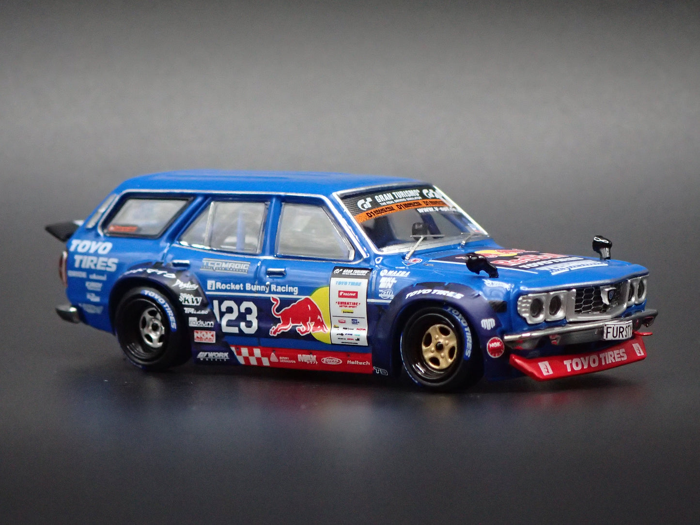 1971-1978 MAZDA RX3 STATION AGON RED BULL MAD MIKE 1:64 SCALE DIORAMA DIECAST MODEL CAR