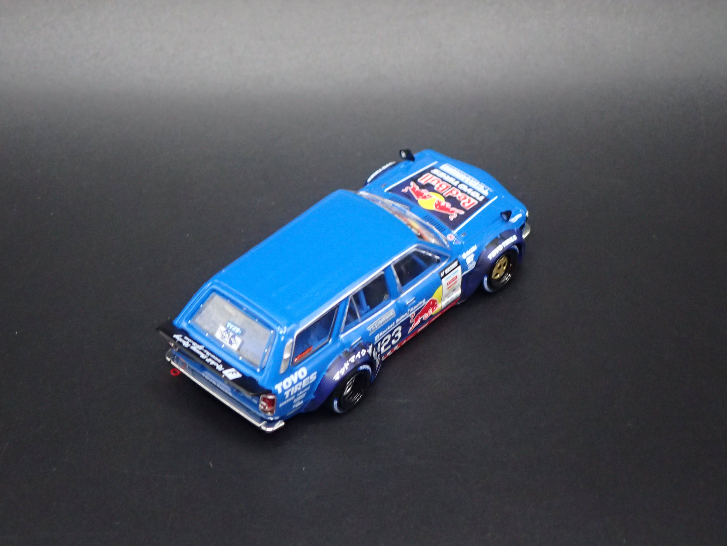 1971-1978 MAZDA RX3 STATION AGON RED BULL MAD MIKE 1:64 SCALE DIORAMA DIECAST MODEL CAR