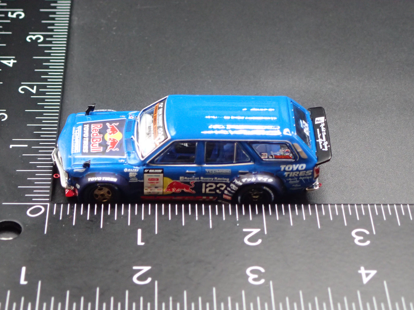 1971-1978 MAZDA RX3 STATION AGON RED BULL MAD MIKE 1:64 SCALE DIORAMA DIECAST MODEL CAR
