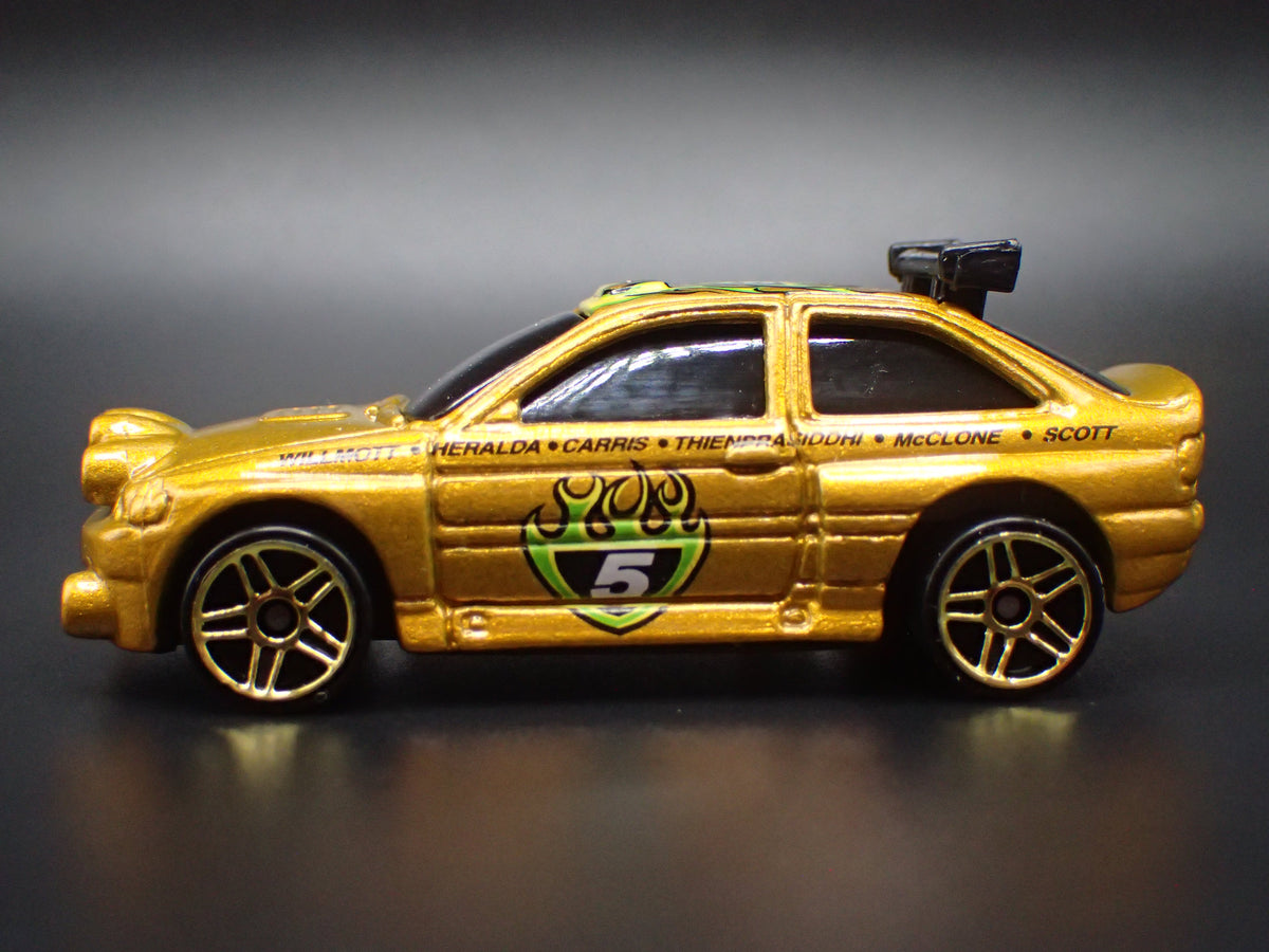 FORD ESCORT RALLY RACING GOLD 1:64 SCALE COLLECTIBLE DIECAST MODEL CAR