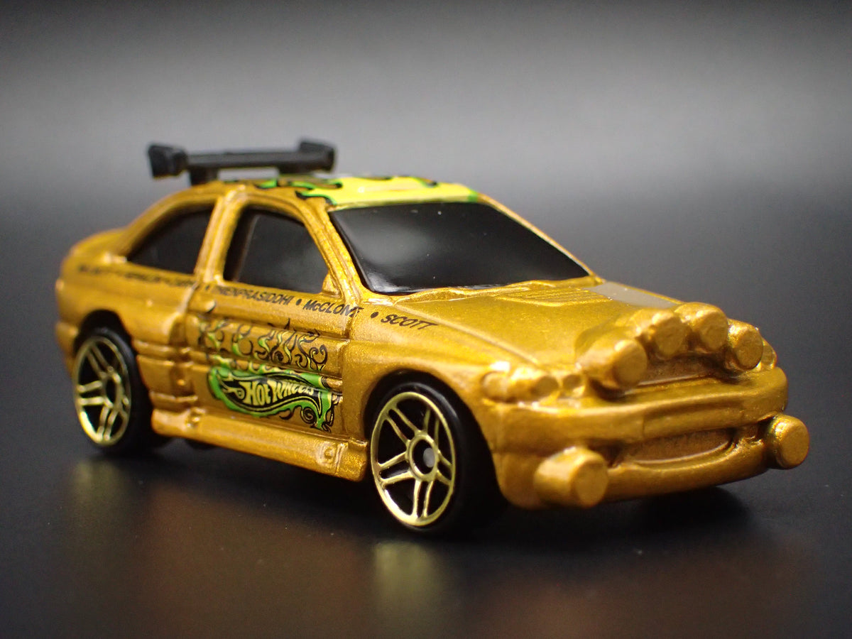 FORD ESCORT RALLY RACING GOLD 1:64 SCALE COLLECTIBLE DIECAST MODEL CAR