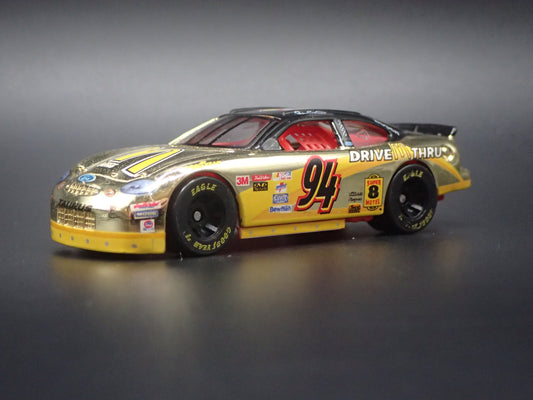1999 99 FORD TAURUS 94 BILL ELLIOTT GOLD NASCAR 1/64 SCALE DIECAST MODEL CAR