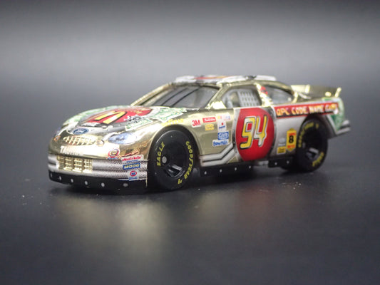 1999 99 FORD TAURUS 94 BILL ELLIOTT GOLD NASCAR 1/64 SCALE DIECAST MODEL CAR