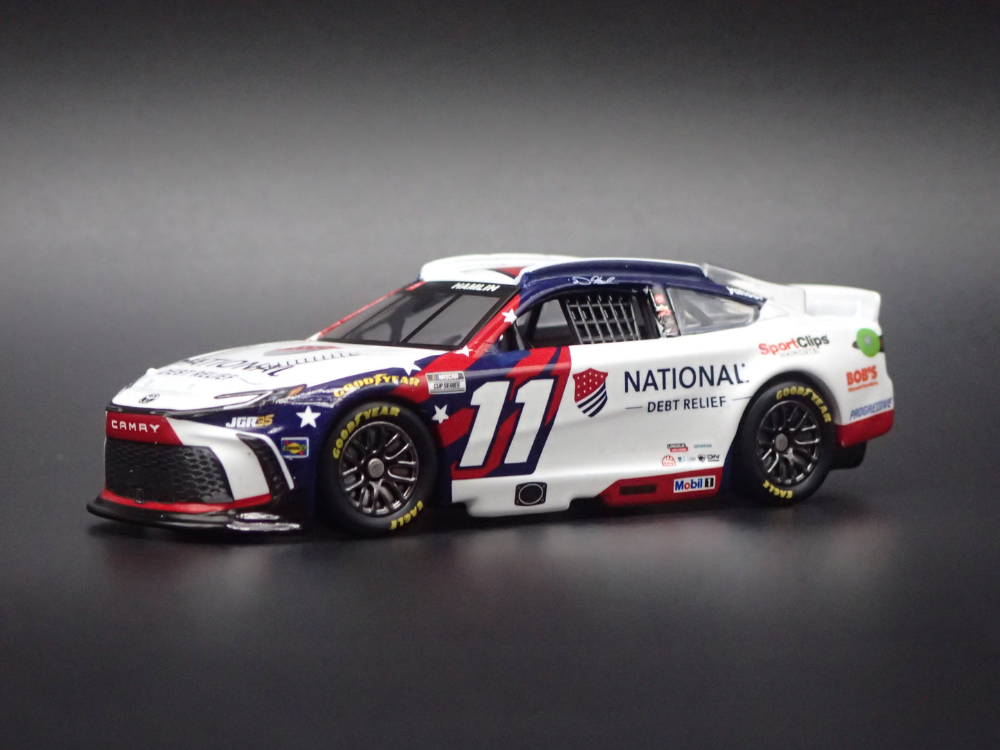 2026 26 TOYOTA CAMRY 11 DENNY HAMLIN DEBT RELIEF NASCAR 1:64 SCALE DIECAST CAR