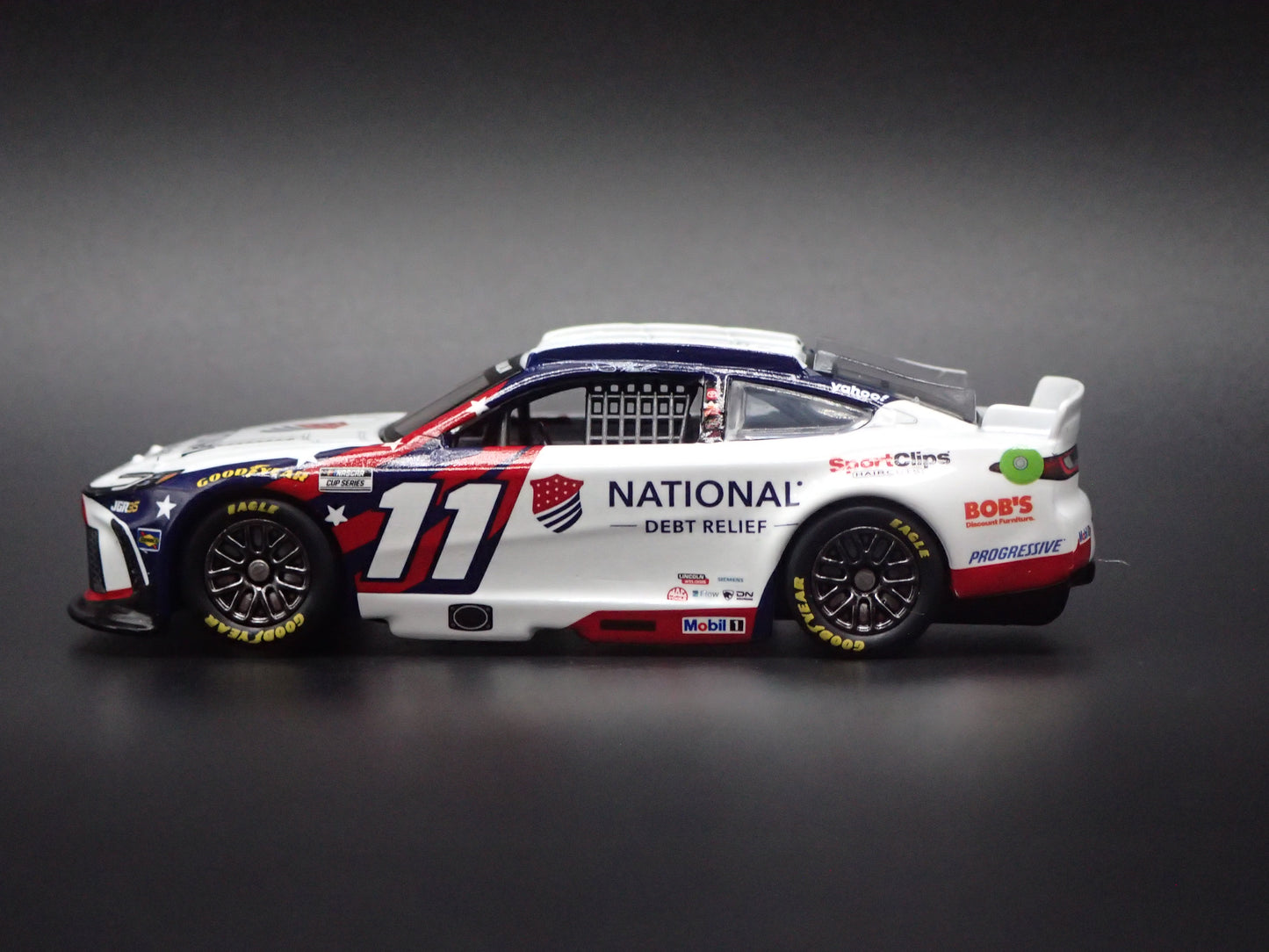 2026 26 TOYOTA CAMRY 11 DENNY HAMLIN DEBT RELIEF NASCAR 1:64 SCALE DIECAST CAR