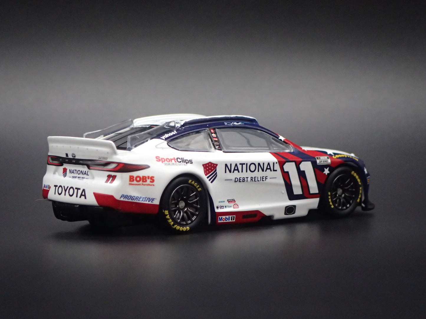 2026 26 TOYOTA CAMRY 11 DENNY HAMLIN DEBT RELIEF NASCAR 1:64 SCALE DIECAST CAR