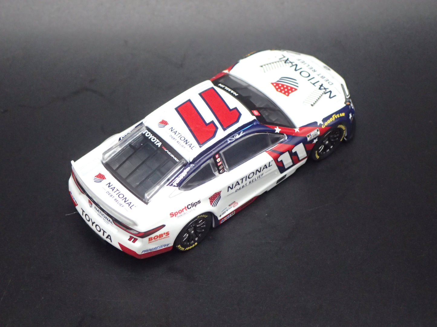 2026 26 TOYOTA CAMRY 11 DENNY HAMLIN DEBT RELIEF NASCAR 1:64 SCALE DIECAST CAR