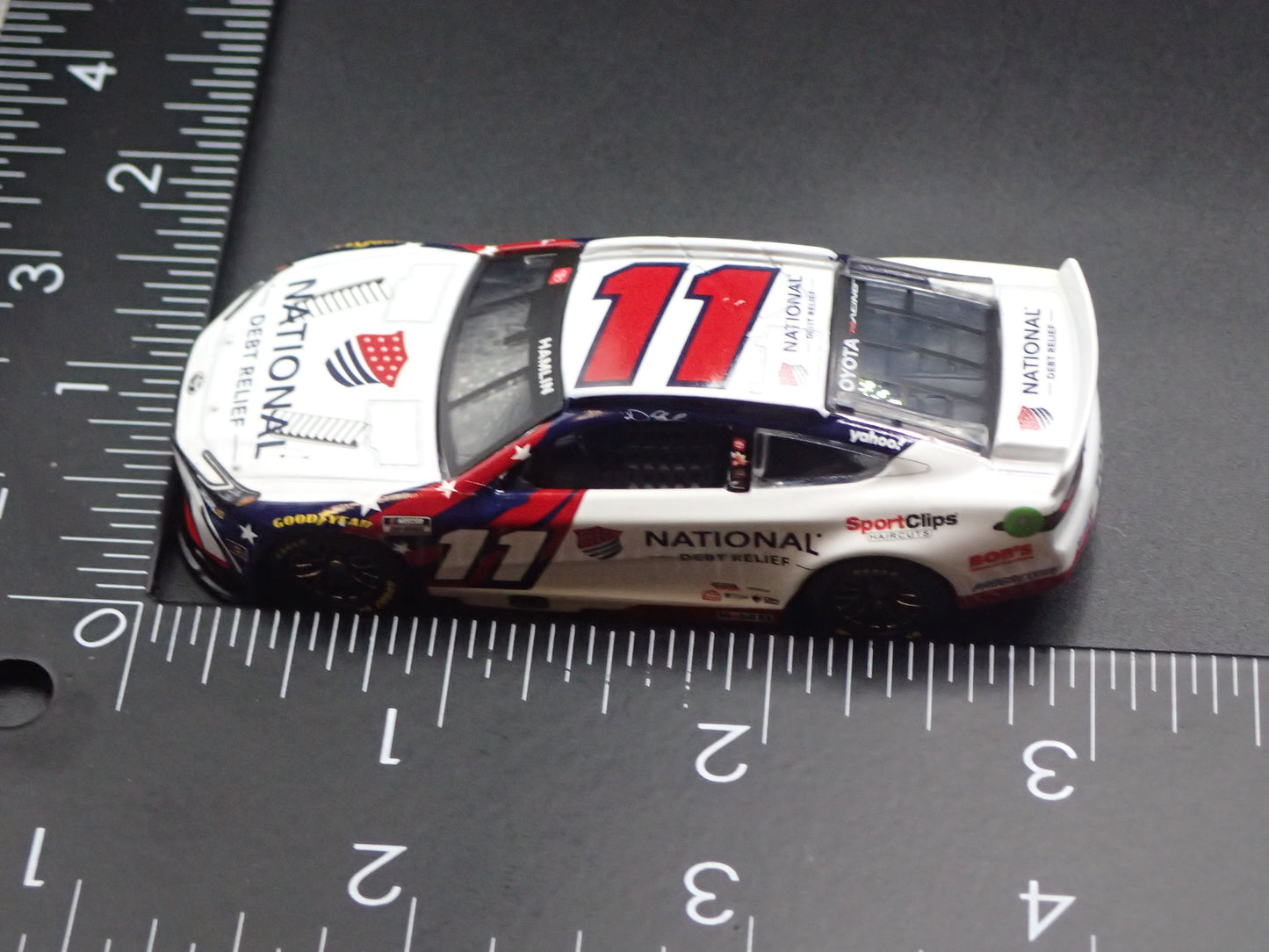 2026 26 TOYOTA CAMRY 11 DENNY HAMLIN DEBT RELIEF NASCAR 1:64 SCALE DIECAST CAR