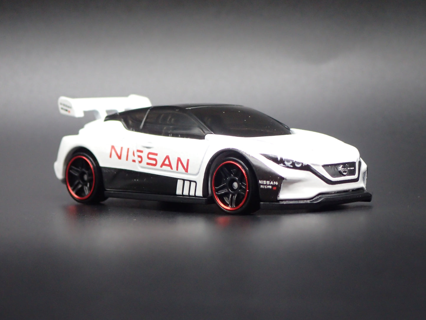 NISSAN LEAF NISMO RC 02 WHITE 1:64 SCALE COLLECTIBLE DIECAST MODEL CAR