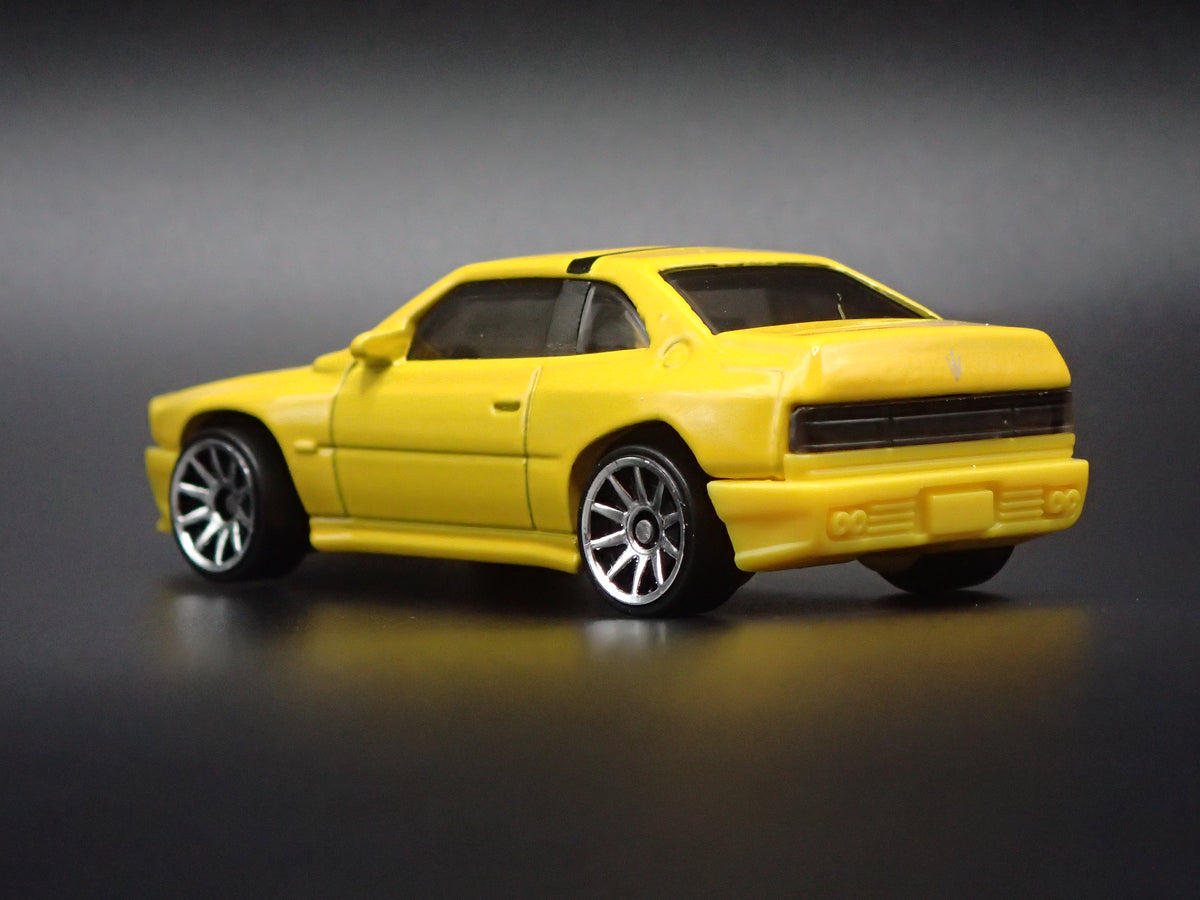1990-1996 MASERATI SHAMAL YELLOW 1:64 SCALE COLLECTIBLE DIECAST MODEL CAR