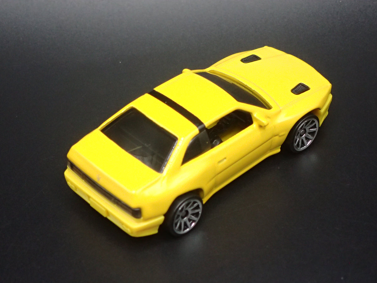 1990-1996 MASERATI SHAMAL YELLOW 1:64 SCALE COLLECTIBLE DIECAST MODEL CAR