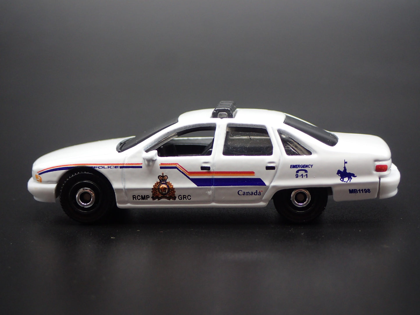 1991-1996 CHEVY CHEVROLET CAPRICE POLICE RCMP GRC CANADA 1/64 DIECAST MODEL CAR