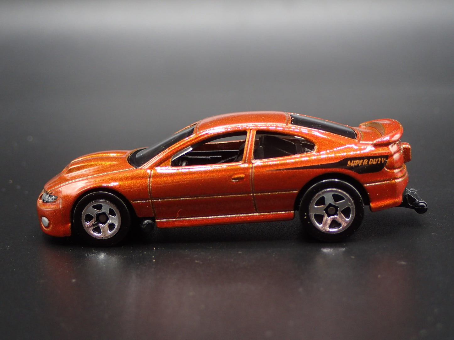 2004-2006 PONTIAC GTO ORANGE 1:64 SCALE COLLECTIBLE DIORAMA DIECAST MODEL CAR