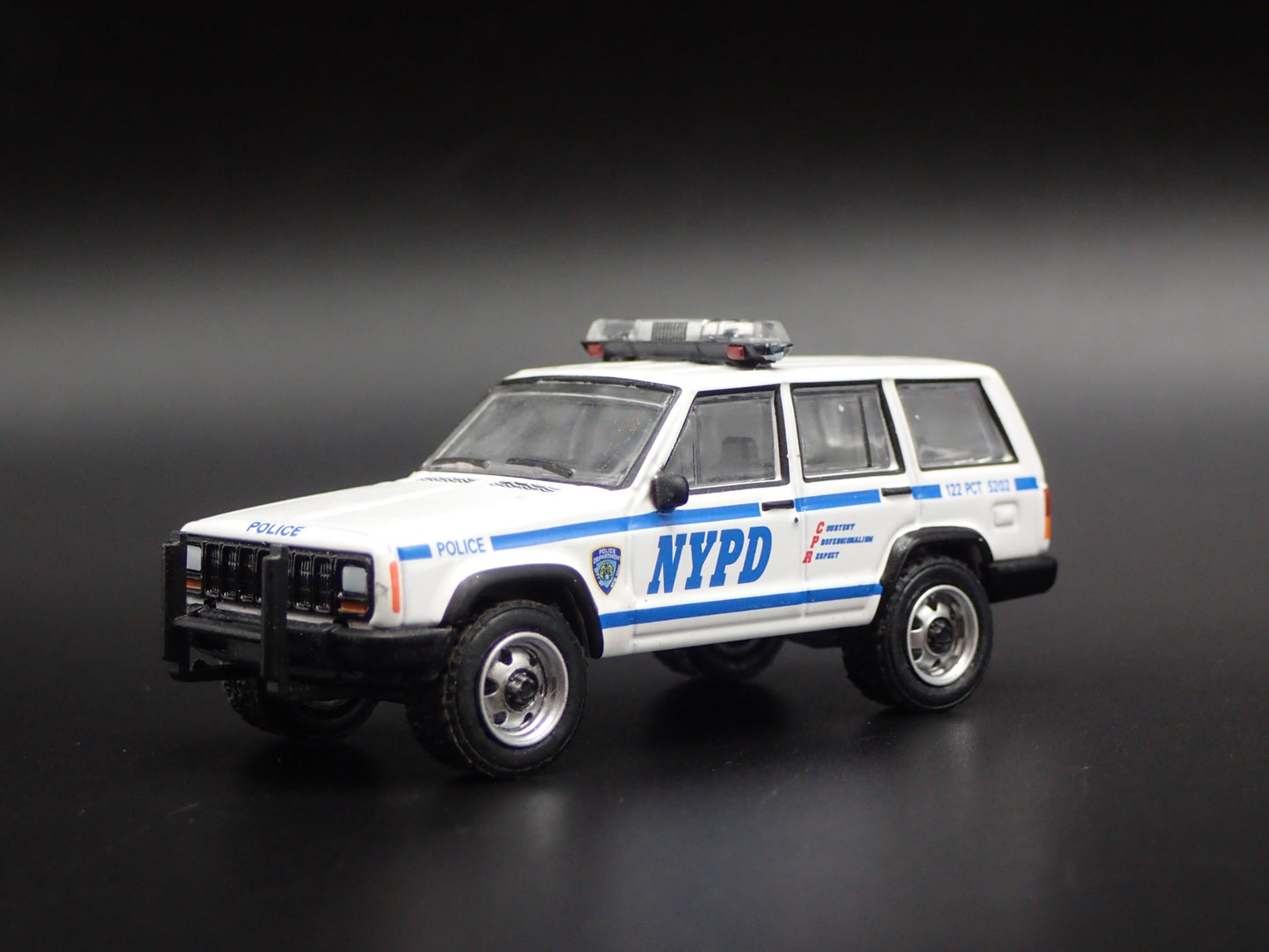 JEEP CHEROKEE XJ SPORT 4 DOOR NEW YORK NYPD POLICE 1:64 SCALE DIECAST MODEL CAR