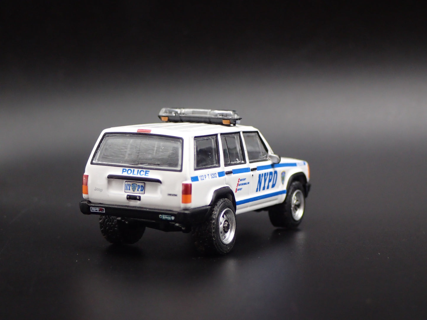 JEEP CHEROKEE XJ SPORT 4 DOOR NEW YORK NYPD POLICE 1:64 SCALE DIECAST MODEL CAR