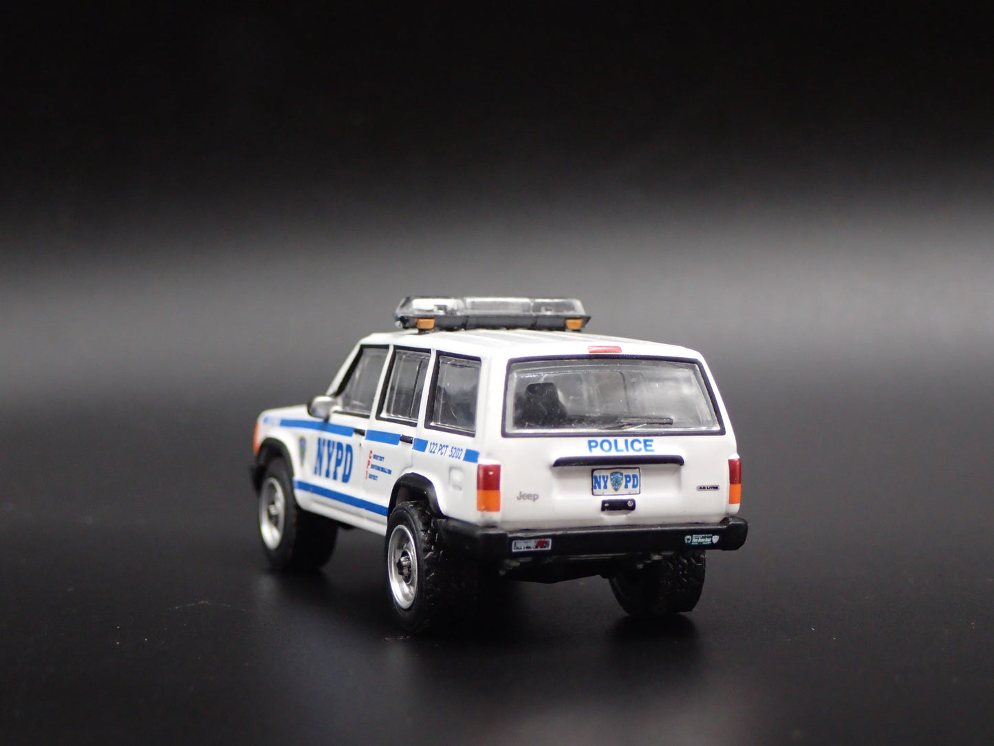JEEP CHEROKEE XJ SPORT 4 DOOR NEW YORK NYPD POLICE 1:64 SCALE DIECAST MODEL CAR