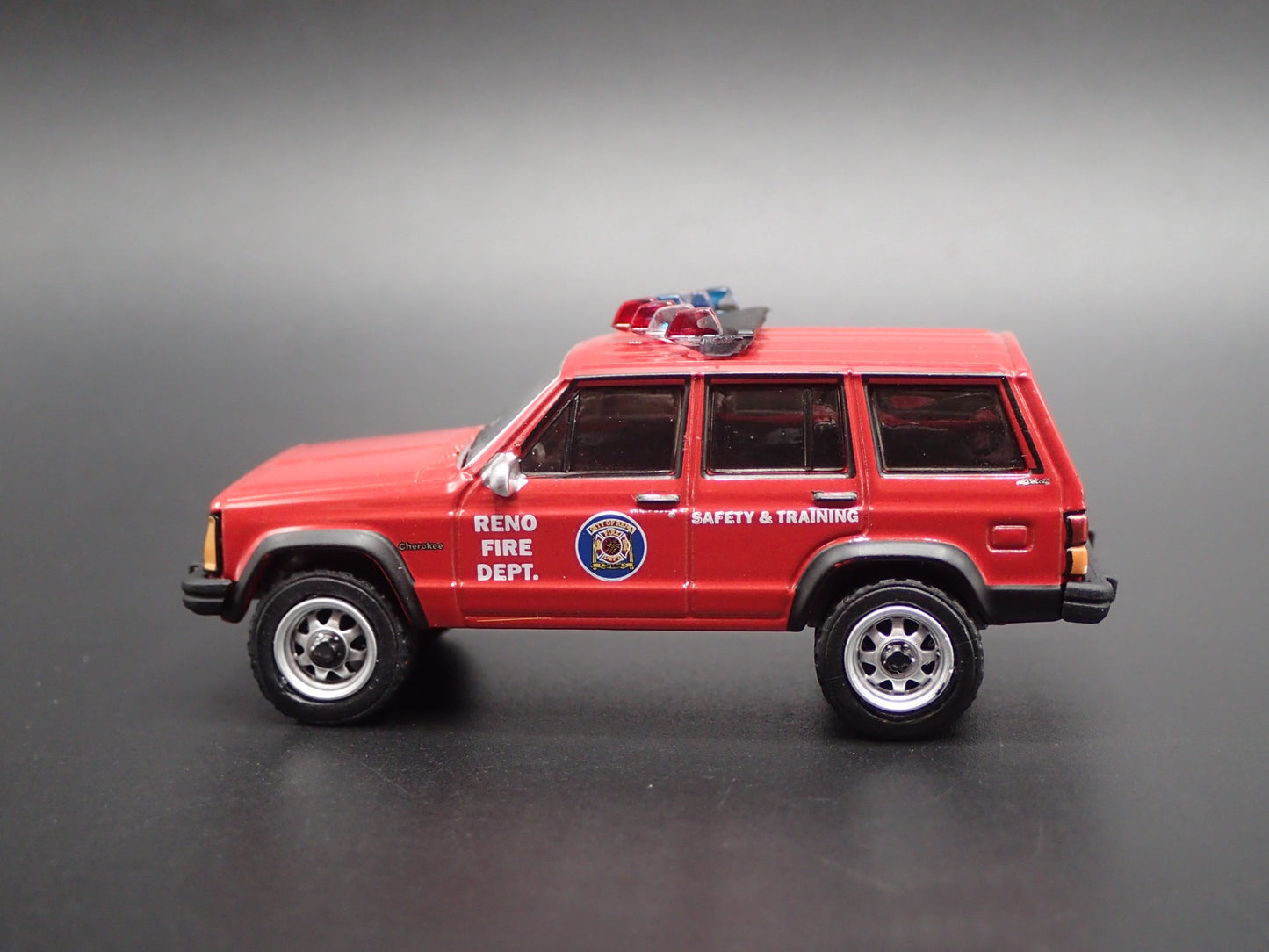 1990 JEEP CHEROKEE XJ RENO, NEVADA FIRE DEPARTMENT 1:64 SCALE DIECAST MODEL CAR