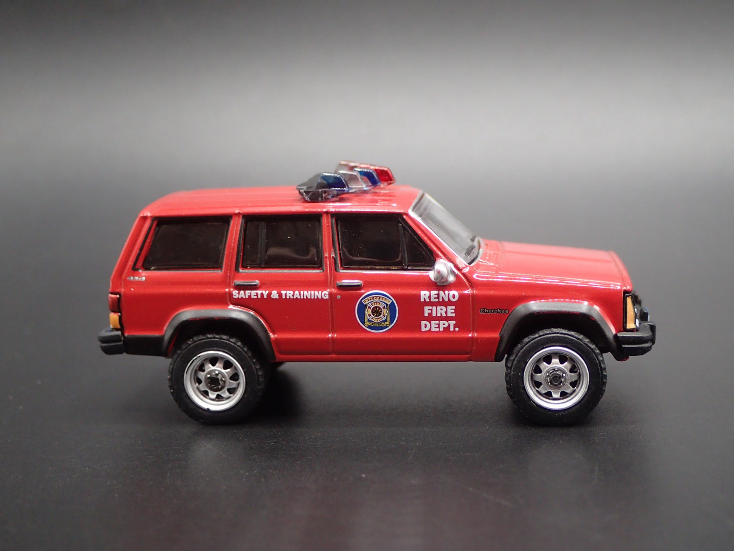 1990 JEEP CHEROKEE XJ RENO, NEVADA FIRE DEPARTMENT 1:64 SCALE DIECAST MODEL CAR