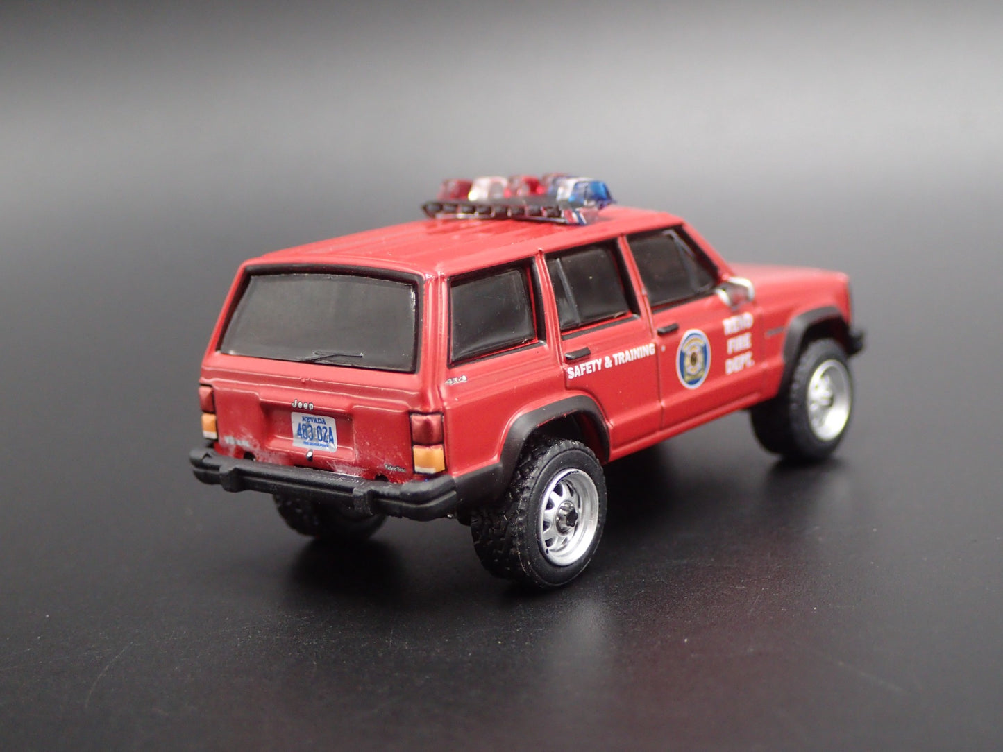 1990 JEEP CHEROKEE XJ RENO, NEVADA FIRE DEPARTMENT 1:64 SCALE DIECAST MODEL CAR