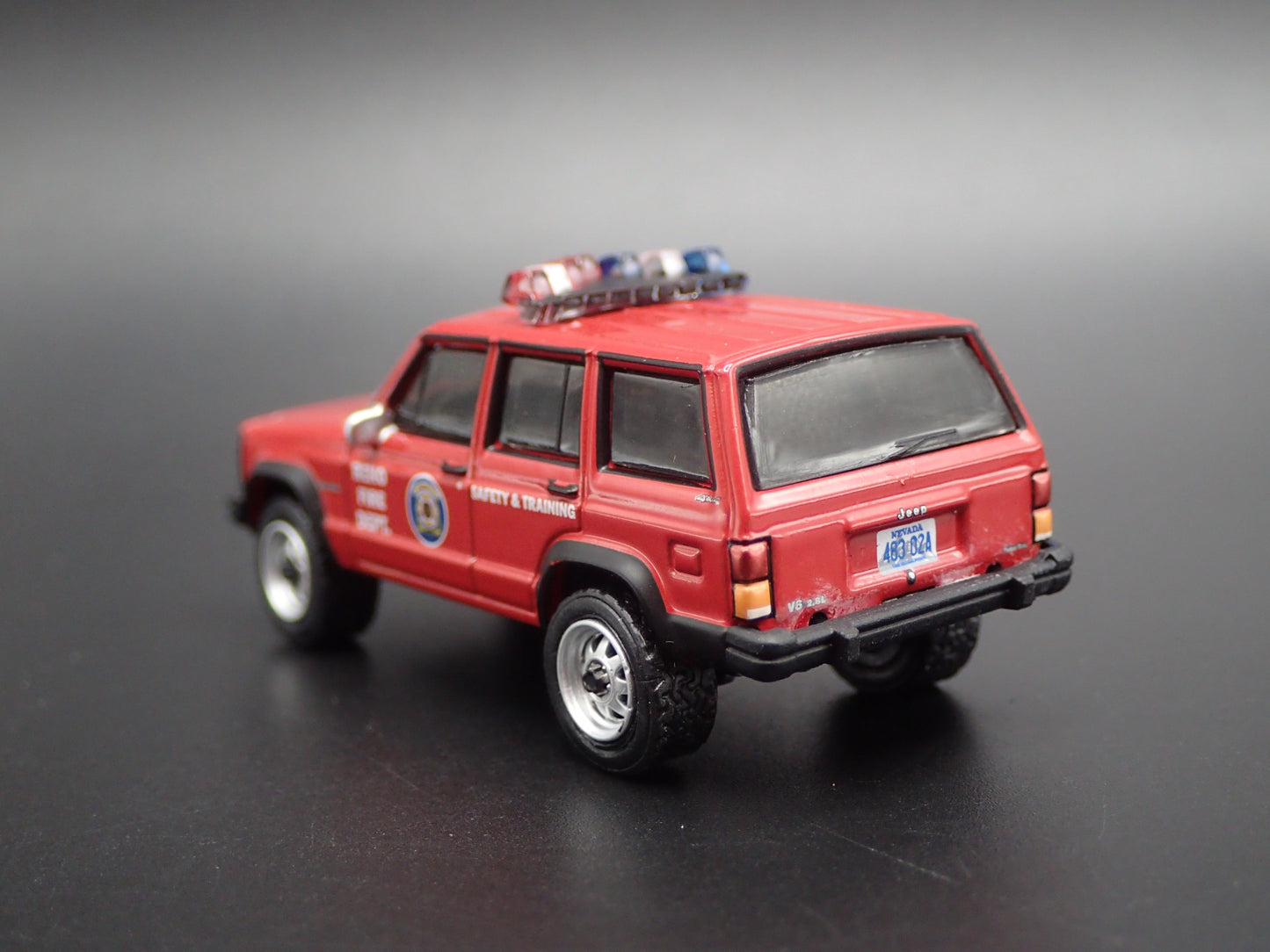 1990 JEEP CHEROKEE XJ RENO, NEVADA FIRE DEPARTMENT 1:64 SCALE DIECAST MODEL CAR