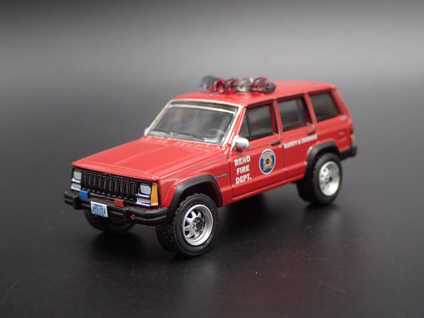1990 JEEP CHEROKEE XJ RENO, NEVADA FIRE DEPARTMENT 1:64 SCALE DIECAST MODEL CAR