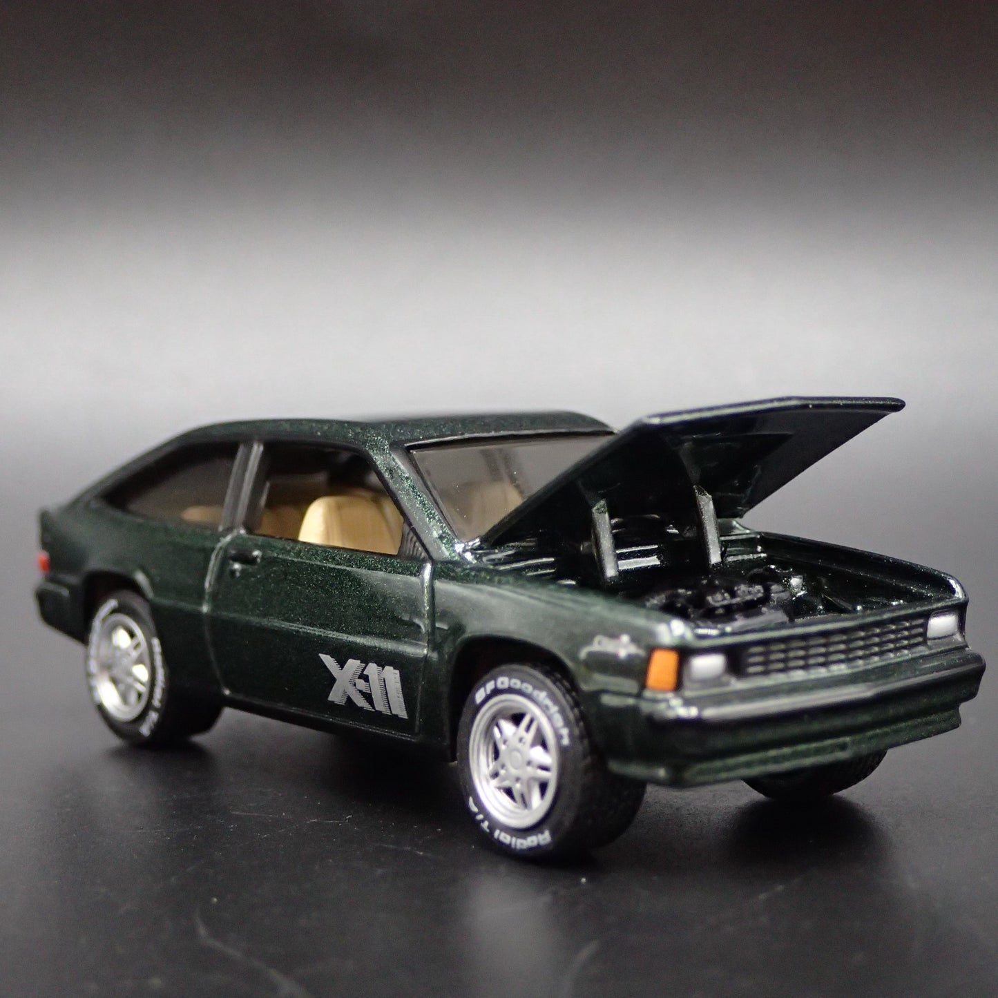 1981 81 CHEVY CHEVROLET CITATION X-11 GREEN 1:64 SCALE DIORAMA DIECAST MODEL CAR