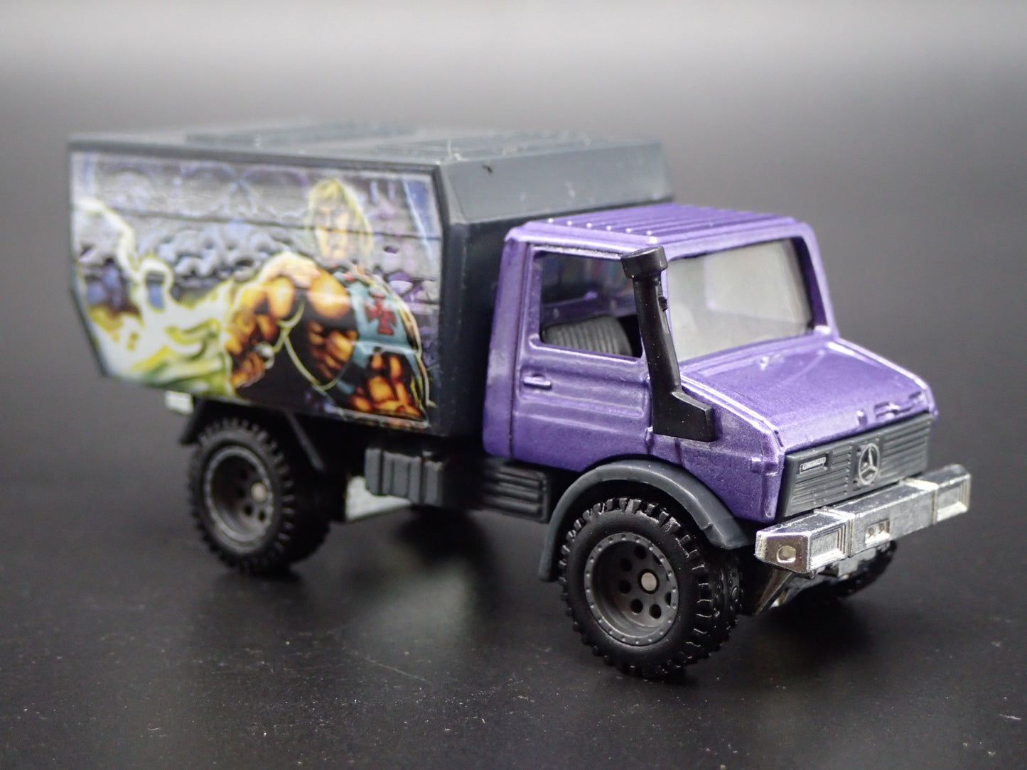 MERCEDES-BENZ UNIMOG U 1300L MASTERS OF UNIVERSE  1:64 SCALE DIECAST MODEL CAR