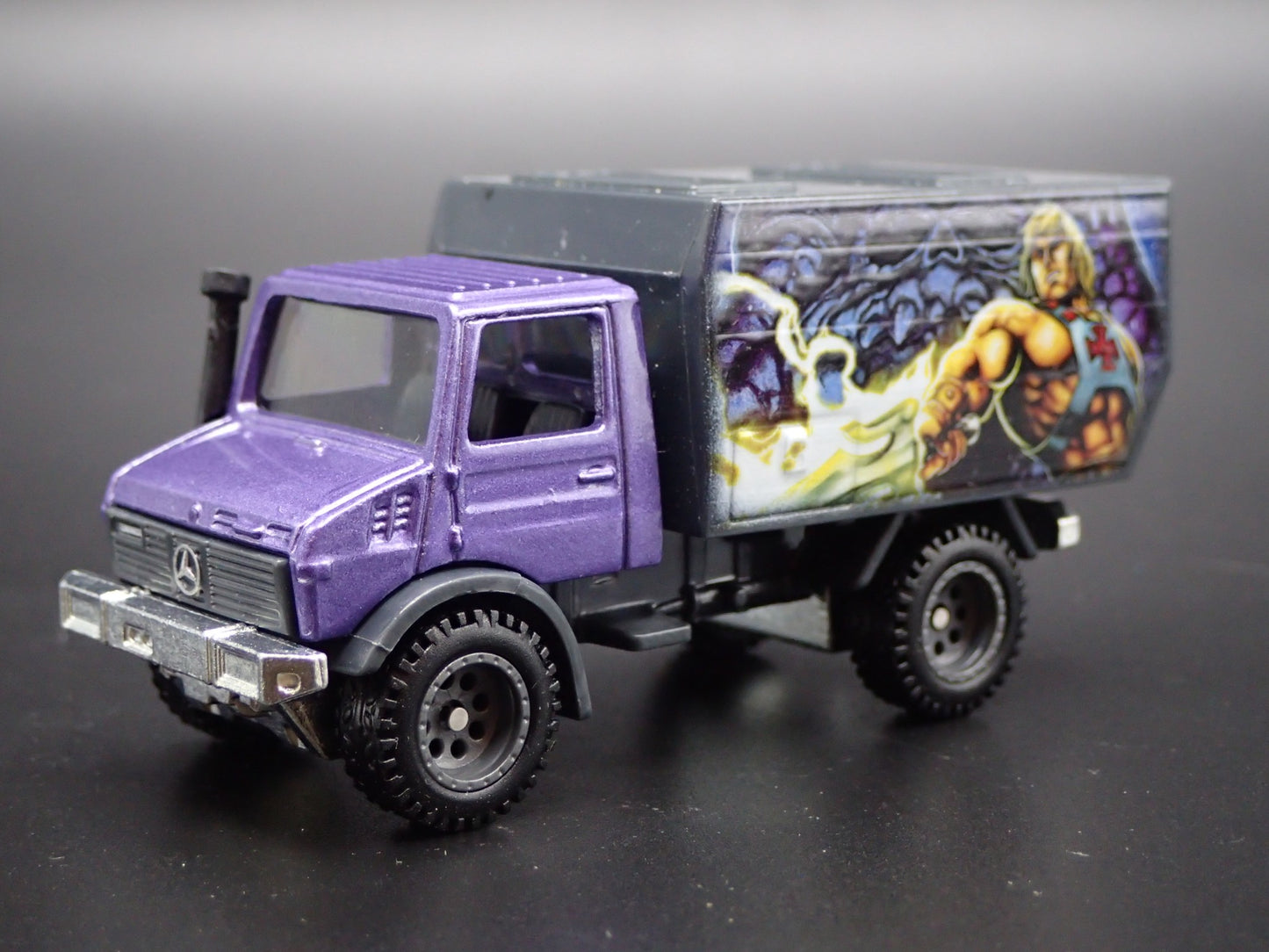 MERCEDES-BENZ UNIMOG U 1300L MASTERS OF UNIVERSE  1:64 SCALE DIECAST MODEL CAR