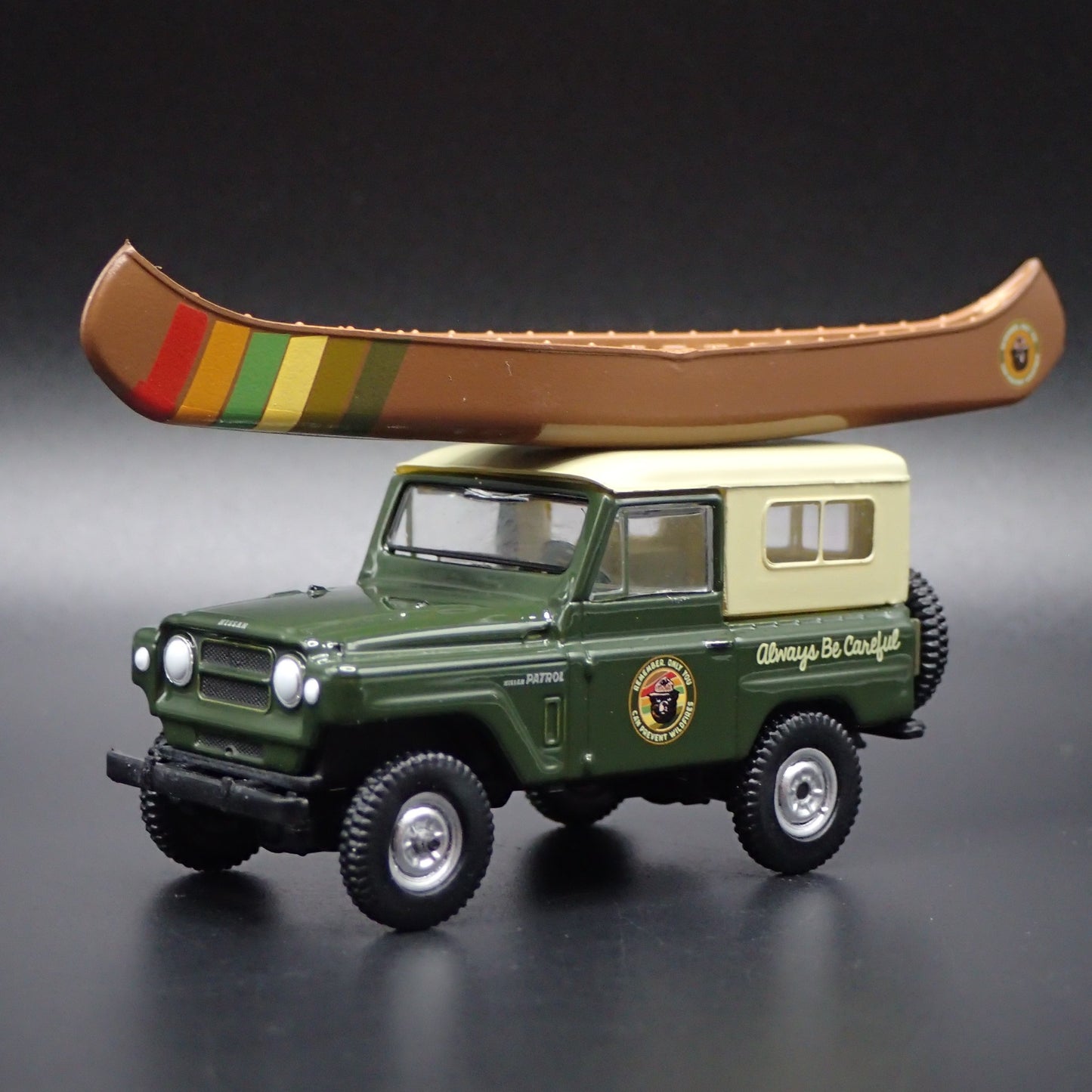 1960-1980 NISSAN PATROL W CANOE SMOKEY BEAR GREEN 1:64 SCALE DIECAST MODEL CAR