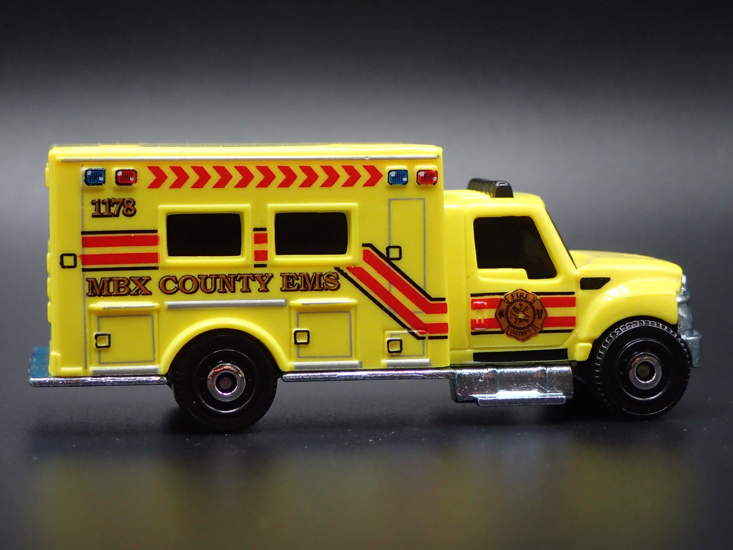 INTERNATIONAL WORKSTAR AMBULANCE MBX COUNTY EMS 1:64 MB SCALE DIECAST MODEL CAR