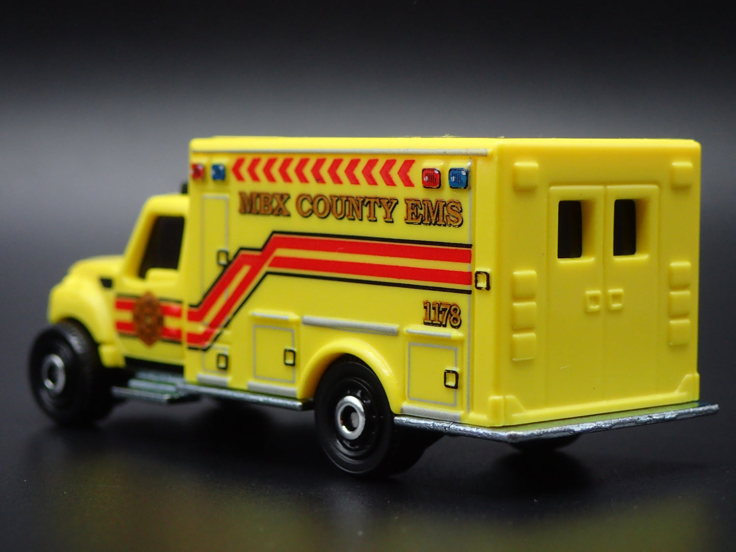 INTERNATIONAL WORKSTAR AMBULANCE MBX COUNTY EMS 1:64 MB SCALE DIECAST MODEL CAR