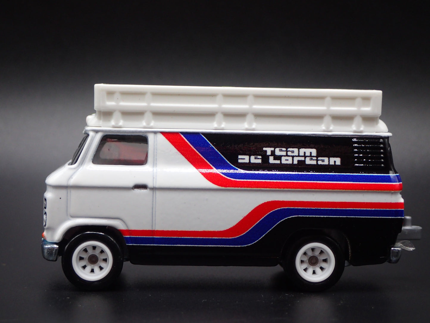 1965-1977 FORD TRANSIT SUPER VAN DELOREAN RACING 1:64 SCALE DIECAST MODEL CAR