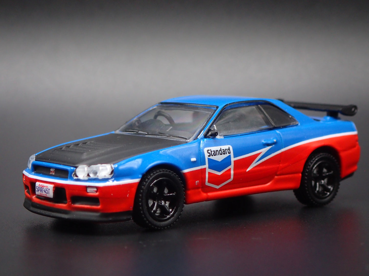 1999-2002 NISSAN SKYLINE GTR R34 STANDARD CHEVRON 1:64 SCALE DIECAST MODEL CAR