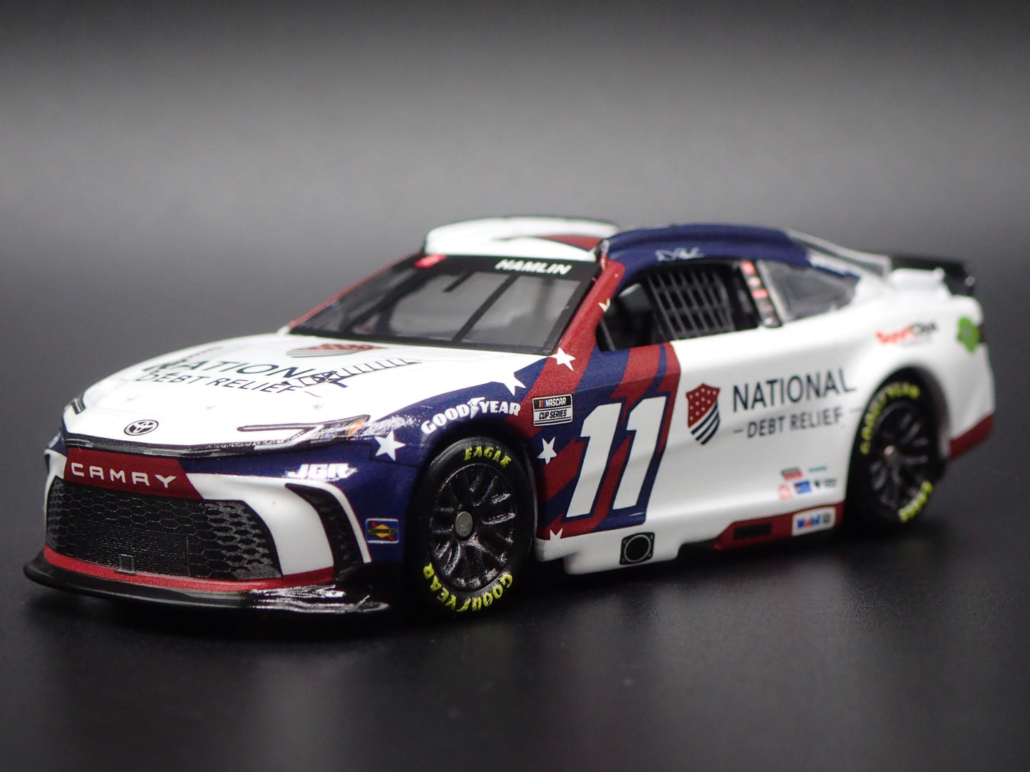 2025 25 TOYOTA CAMRY 11 DENNY HAMLIN DEBT RELIEF NASCAR 1:64 SCALE DIECAST CAR